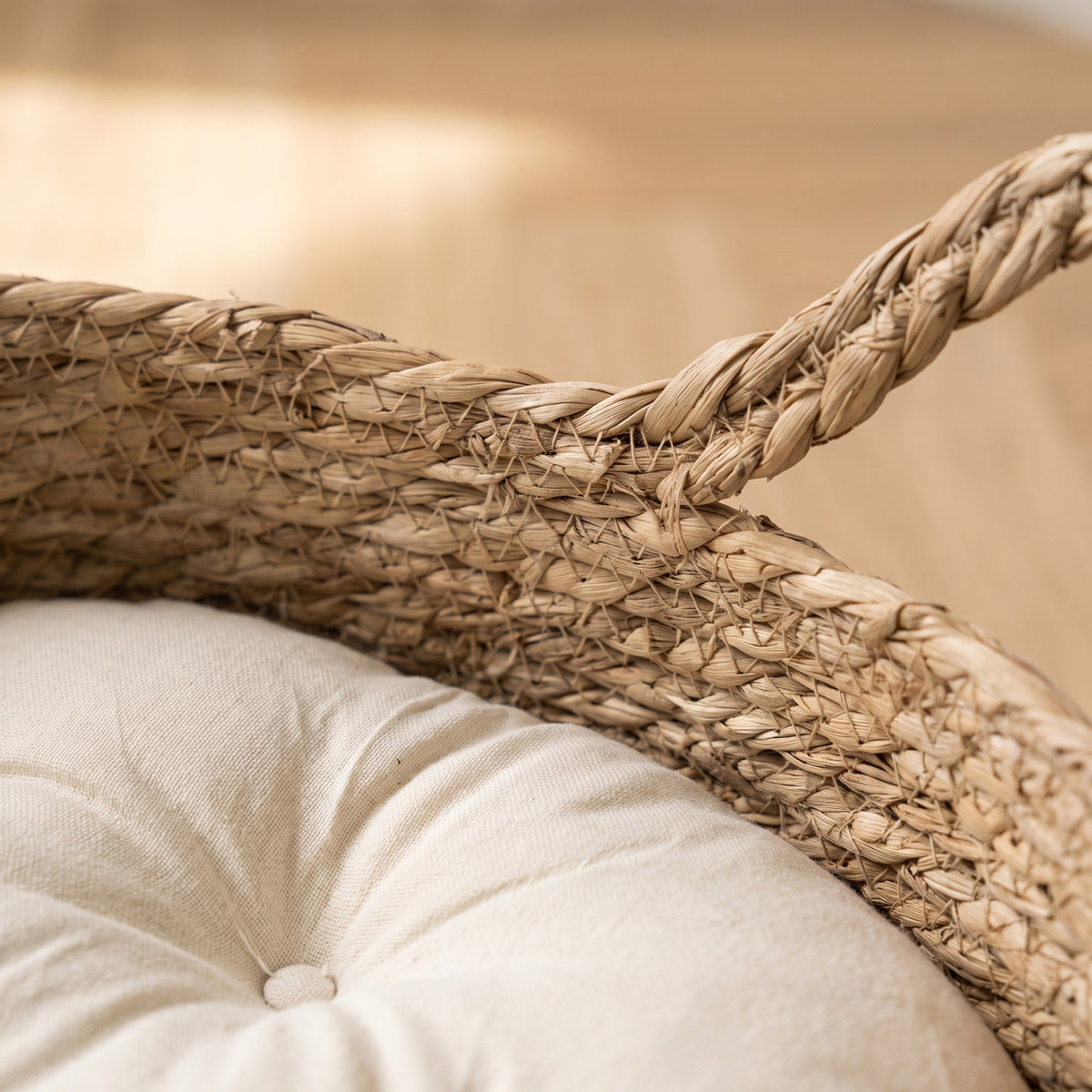 Coil Basket Bed - woven seagrass and cushion seam close up