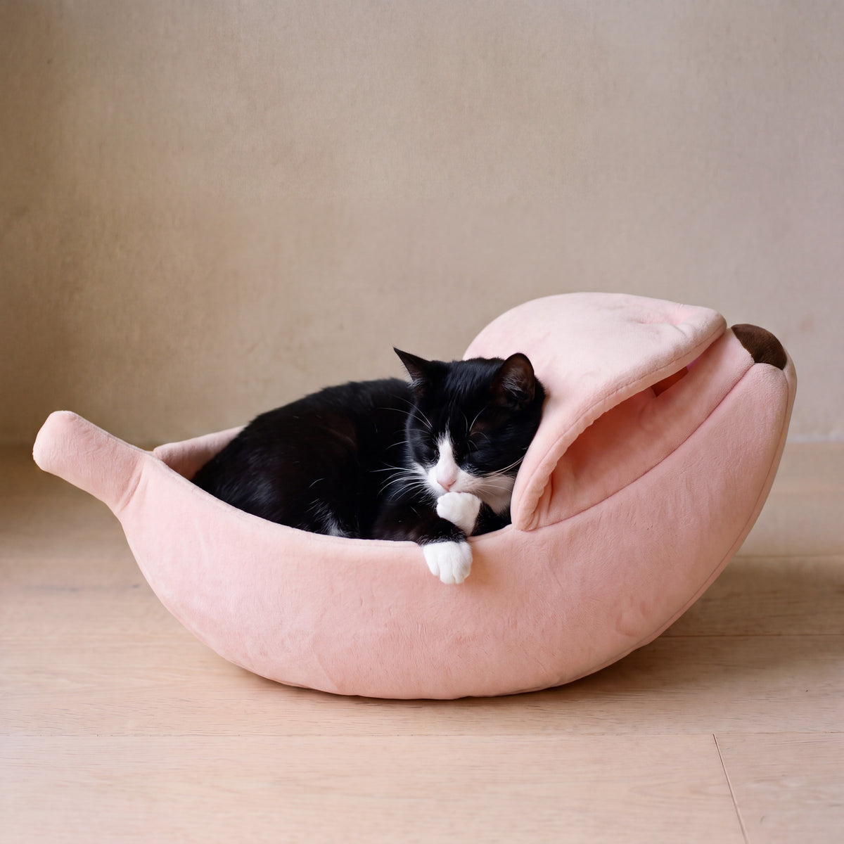 Snug Banana Bed - Pink - with a cat